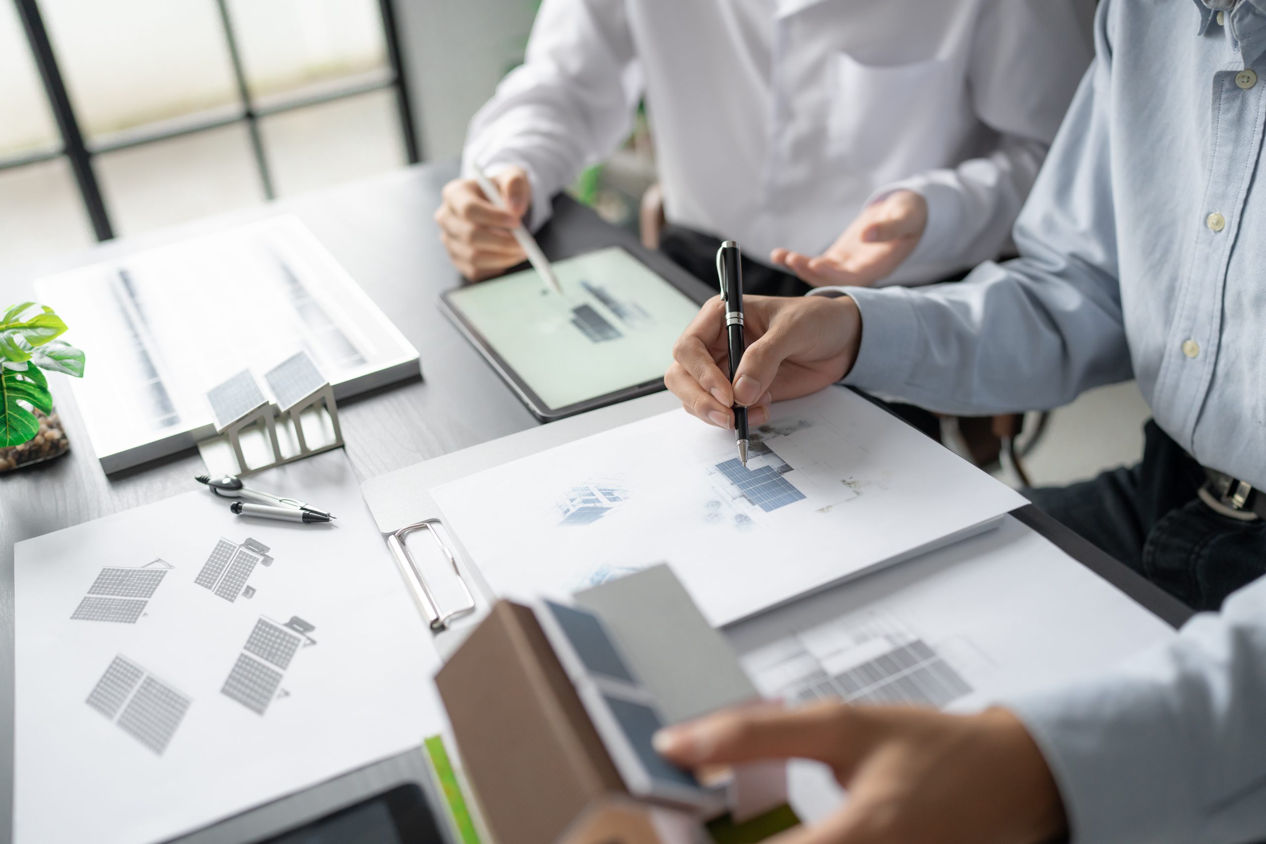 Solar panels green energy Business man working green eco friendly office business creative idea Planing Bio economy for business eco friendly professional Engineer sustainable electricity.